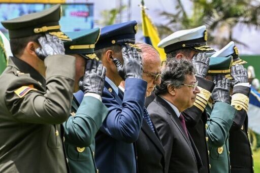 Colombian President Gustavo Petro (4-R) and Colombian Defense Minister Ivan Velasquez (4-L) attend a military ceremony during the swearing-in of the new National Police Director General Carlos Triana at the General Santander Police School in Bogota on F...