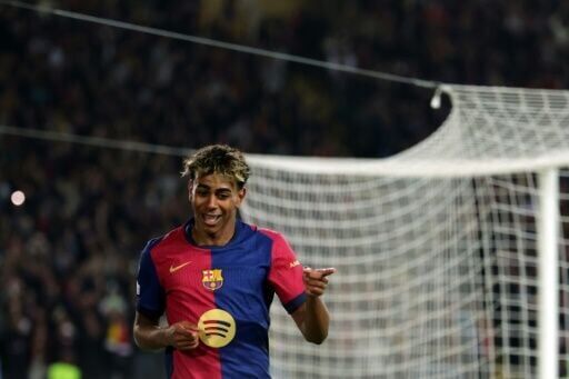 Barcelona forward Lamine Yamal after scoring his side's fourth goal against Borussia Dortmund in the first leg