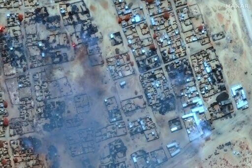 A satellite photo provided by Maxar Technologies shows smoke billowing and buildings burned in Zamzam camp near the besieged city of El-Fasher in Sudan's Darfur