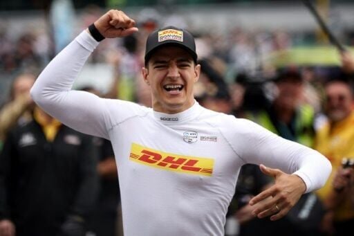 Spain's Alex Palou celebrates after winning the 109th Indianapolis 500