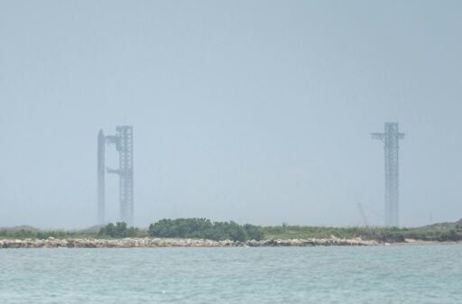 The SpaceX Starship rocket stands on the launchpad ahead of its scheduled launch from the SpaceX Starbase