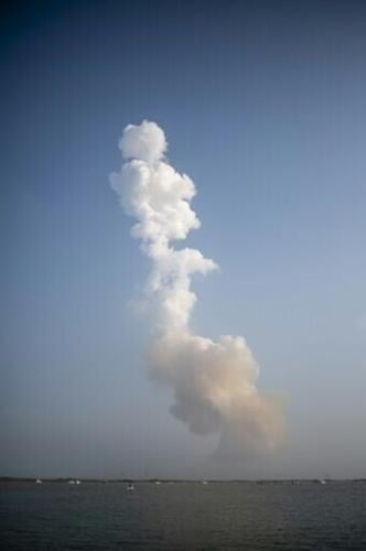 A plume of exhaust from the rocket boosters is left behind after the SpaceX Starship rocket launched from Starbase, Texas, as seen from South Padre Island on May 27, 2025